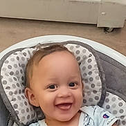 Elijah joined the competition — help win amazing prizes! baby, smiling, infant, child, baby_seat, polka_dot, pillow, indoor, portrait, happy, clothing, sitting, cute, face, young_child, person, human, baby_girl, baby_boy, seat