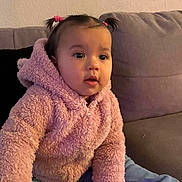 Rose joined the competition — help win amazing prizes! toddler, child, pink_jacket, pigtails, indoor, couch, sofa, curious, seated, casual_clothing, baby, portrait, young_child, cozy, cute, person, home, furniture, face, jeans