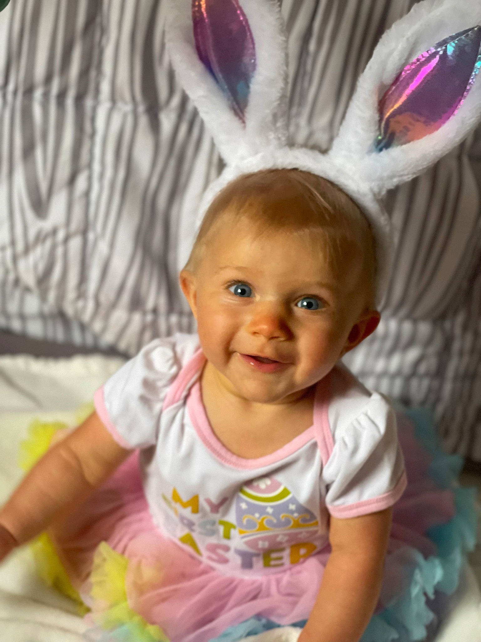 Davina is registered to the contest to win money with this photo: baby, baby_toddler_clothing, clothing, costume_hat, face, facial_expression, fun, hairstyle, happy, head, iris, joy, organ, person, pink, skin, sleeve, smile, standing, t_shirt