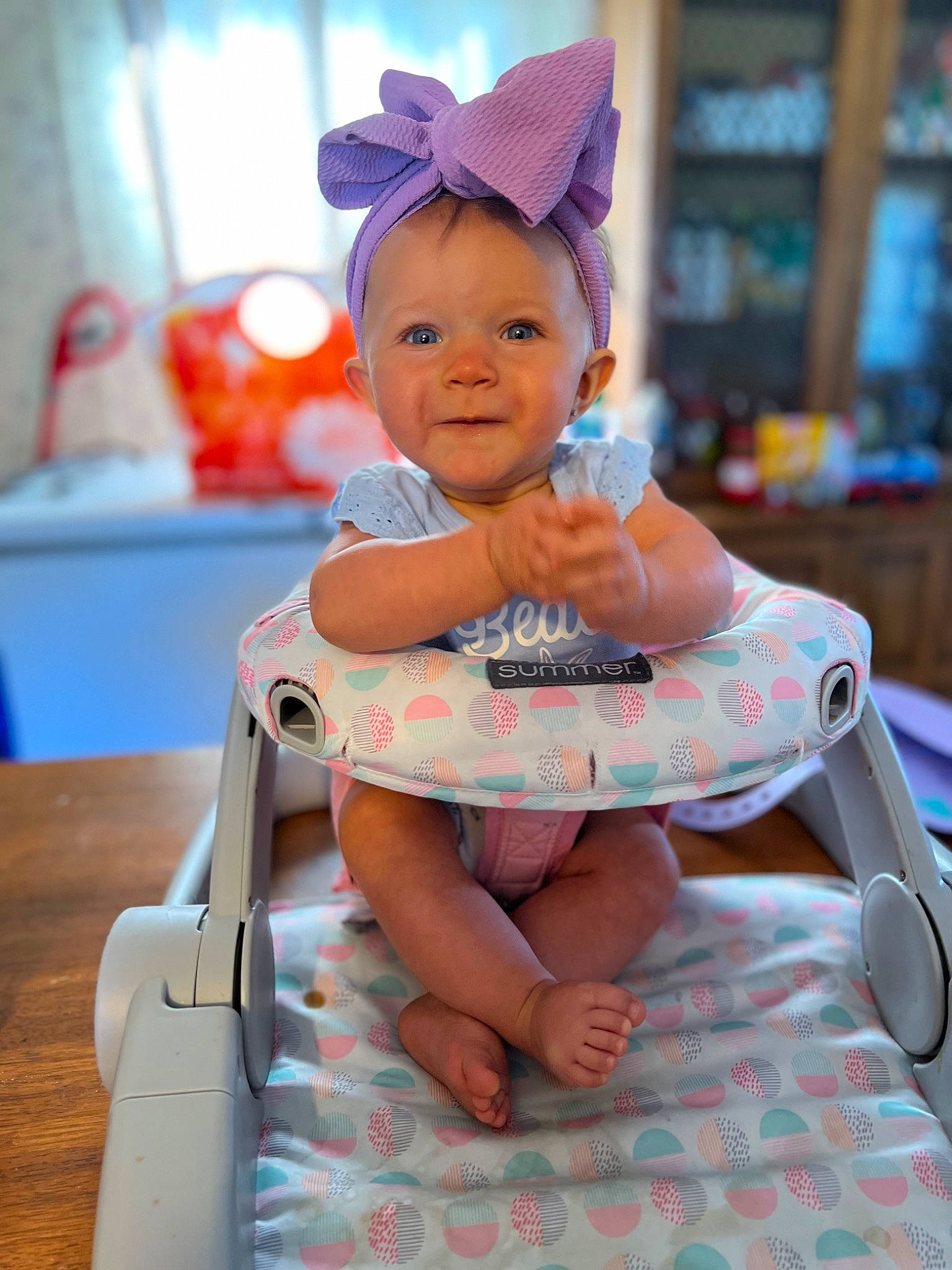 Davina joined the competition — help win amazing prizes! baby, baby_toddler_clothing, blue, cap, child, event, eye, face, fun, happy, hat, human_body, leisure, magenta, person, pink, sitting, skin, smile, toddler