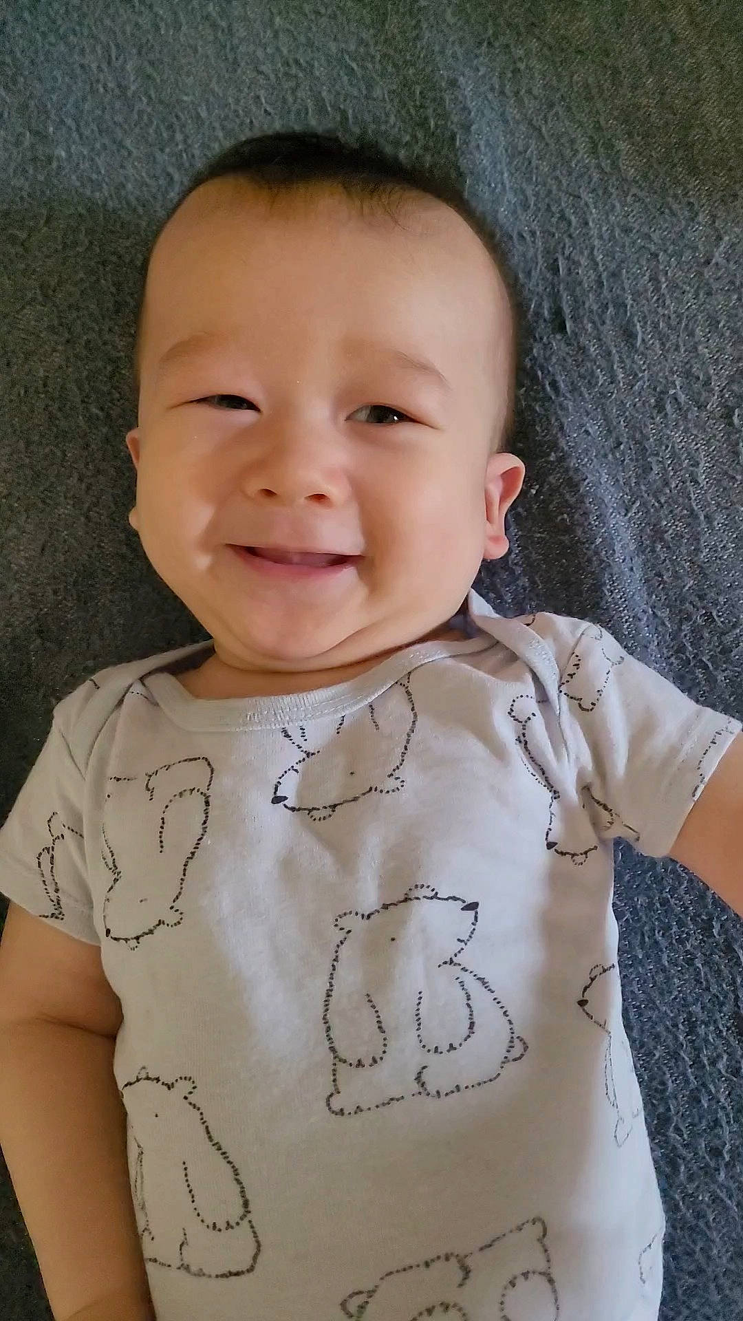 Leighton is registered to the contest to win money with this photo: baby, baby_toddler_clothing, cheek, chin, eye, face, facial_expression, gesture, happy, head, joy, lip, neck, nose, person, shoulder, skin, sleeve, smile, standing