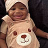 Jayden joined the competition — help win amazing prizes! baby, infant, child, smiling, portrait, bear_hat, bear_outfit, onesie, beige_clothing, couch, seated, indoor, close_up, face, hands, dark_background, cute, happy, baby_fashion, photography