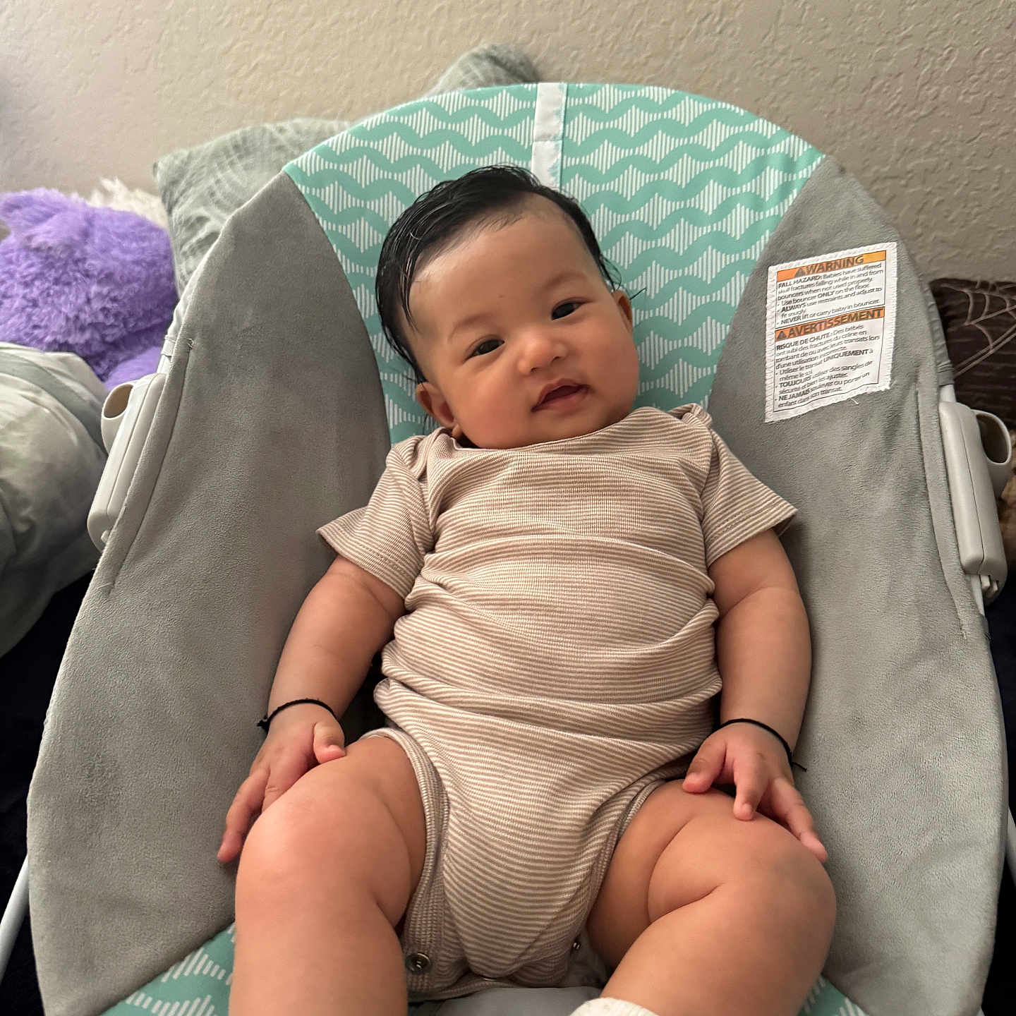 Nityansh joined the competition — help win amazing prizes! baby, child, infant, onesie, sock, baby_chair, cushion, plush_toy, smiling, indoor, person, cute, happy, seated, patterned, fabric, wall, skin, hair, comfort