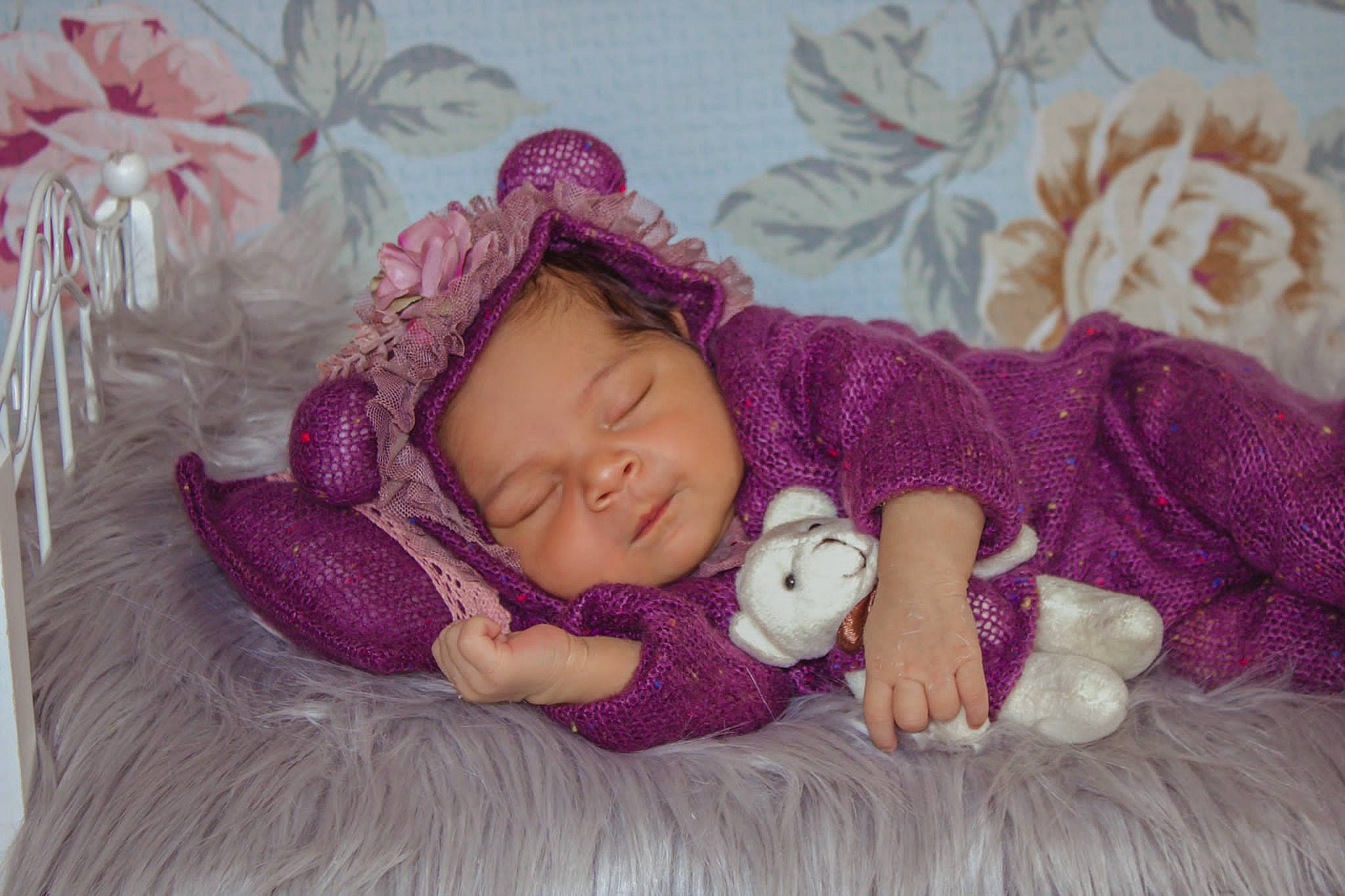 Katherine joined the competition — help win amazing prizes! baby, baby_sleeping, baby_toddler_clothing, cheek, child, comfort, creative_arts, fashion_accessory, headgear, knit_cap, linens, magenta, person, pink, purple, skin, sleeve, textile, toddler, violet