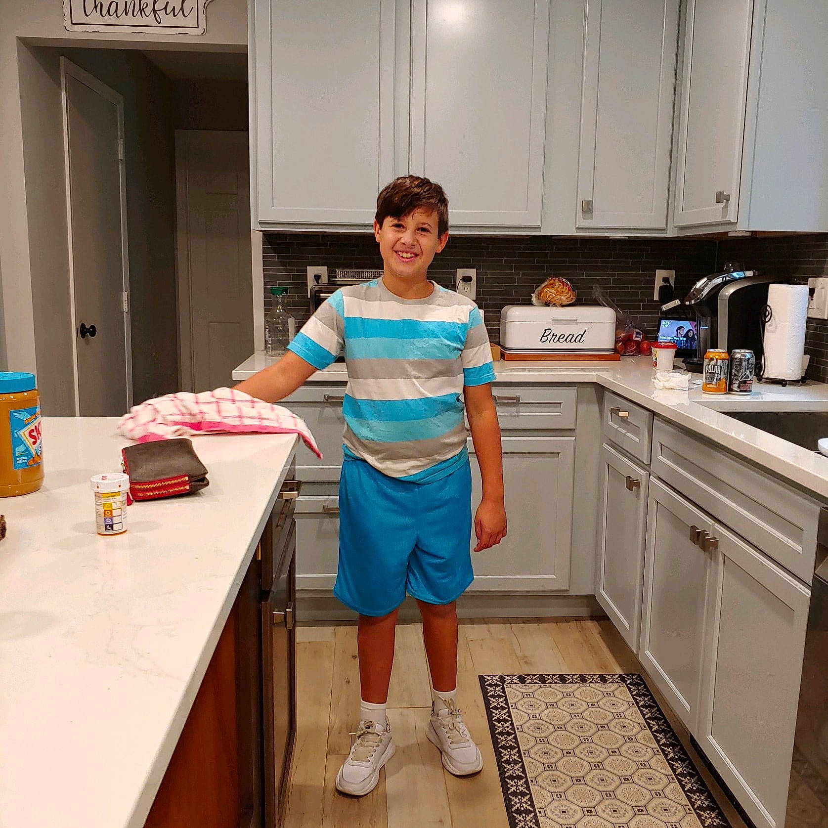 Cayden joined the competition — help win amazing prizes! cabinetry, cooking, countertop, drawer, electric_blue, event, flooring, home_appliance, homemaker, joy, kitchen, kitchen_appliance, kitchen_sink, kitchen_stove, major_appliance, person, room, shorts, sink, smile