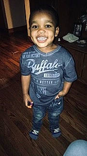 Jermaine is registered to the contest to win money with this photo: black_hair, cheek, child, chin, cool, forehead, fun, happy, joy, male, nose, person, shoe, skin, smile, standing, t_shirt, thumb, toddler, tooth