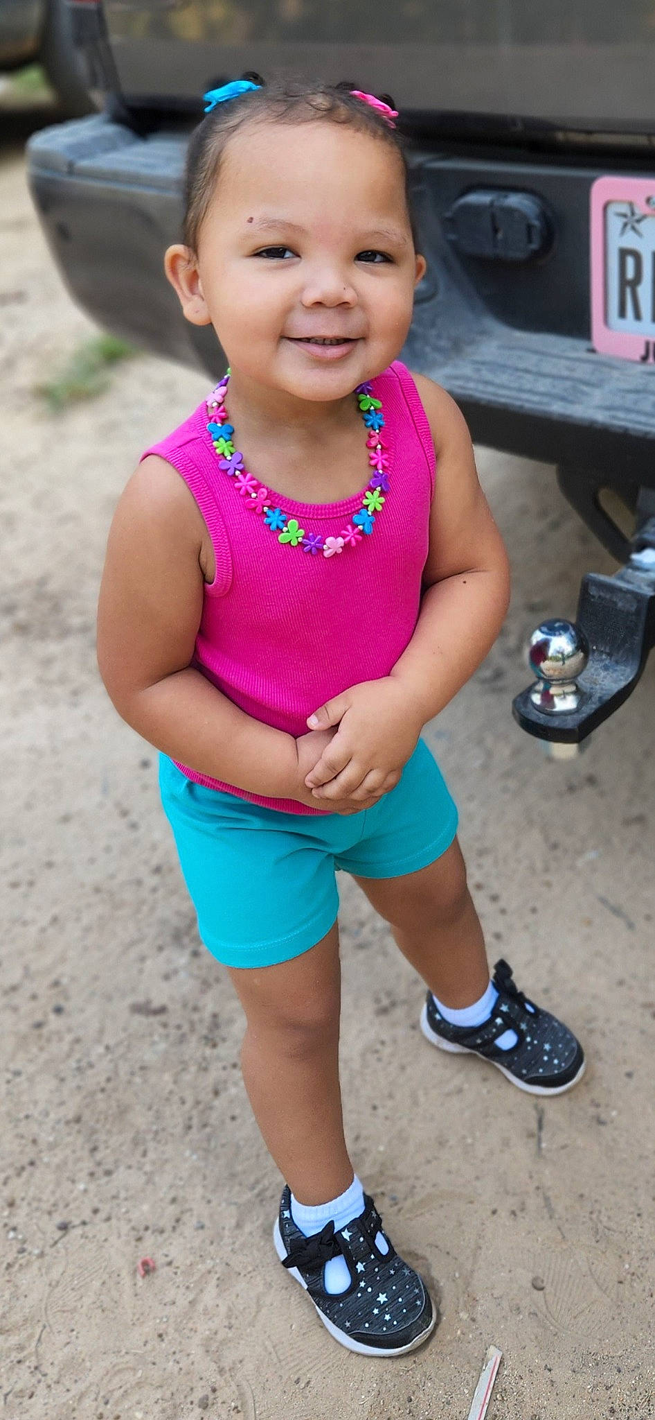 Justice is registered to the contest to win money with this photo: baby_toddler_clothing, child, electric_blue, face, fun, happy, head, human_leg, joy, leg, leisure, magenta, person, pink, shorts, skin, sleeve, smile, t_shirt, thigh