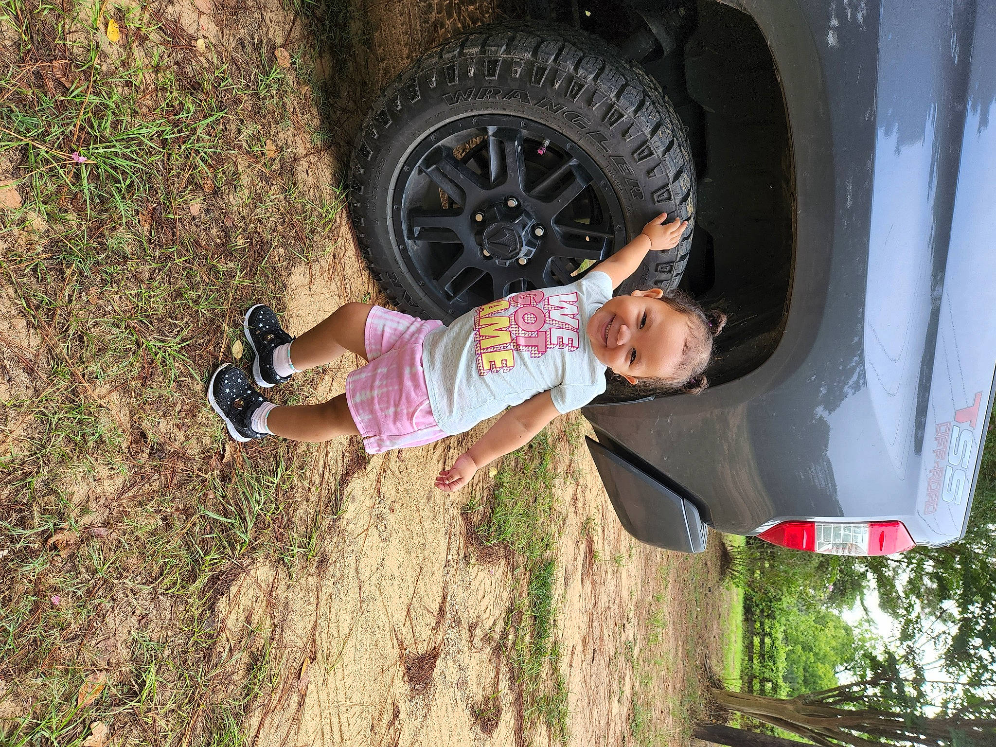 Justice joined the competition — help win amazing prizes! automotive_exterior, automotive_lighting, automotive_tire, automotive_wheel_system, car, fender, fun, joy, motor_vehicle, person, plant, shorts, smile, t_shirt, tire, toddler, tread, tree, vehicle, vehicle_door