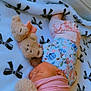 baby, bed, blanket, clothing, cradle, crib, cushion, face, furniture, hat, head, homedecor, infantbed, newborn, person, photography, portrait, quilt, sleeping, toy