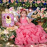 Erin is registered to the contest to win money with this photo: birthdaycake, cake, child, clothing, dress, face, fashion, female, flower, flowerarrangement, flowerbouquet, formalwear, girl, gown, head, person, photography, plant, portrait, rose