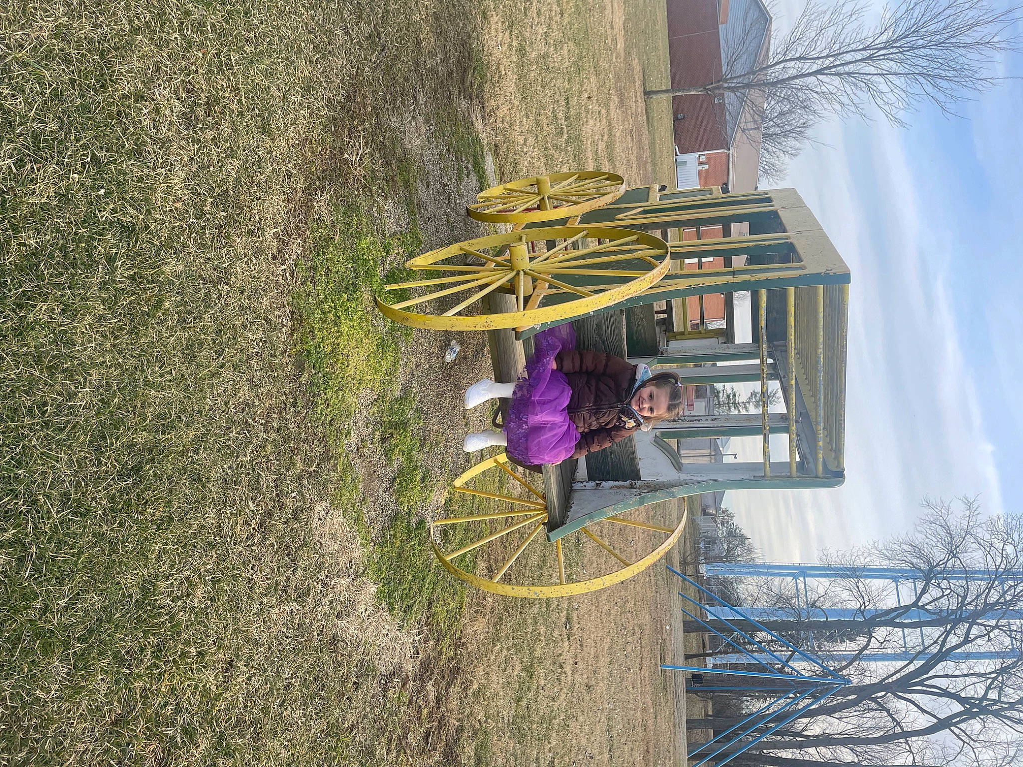 Arizona is registered to the contest to win money with this photo: building, facade, fun, grass, house, joy, landscape, leisure, magenta, people_in_nature, person, plant, pole, sky, soil, tree, trunk, wood