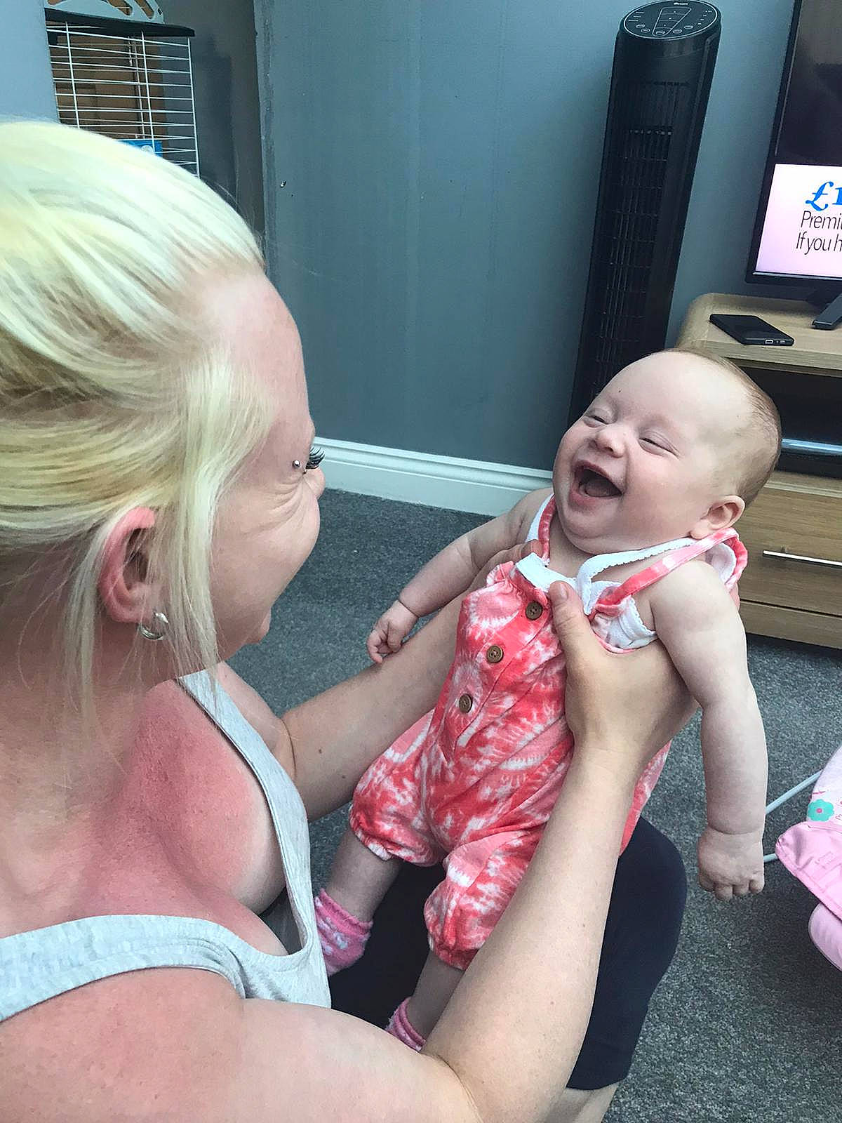 Leanna is registered to the contest to win money with this photo: arm, baby, birth, blond, chest, child, ear, finger, hand, leg, mouth, neck, person, play, skin, smile, summer, toddler, tongue, vacation