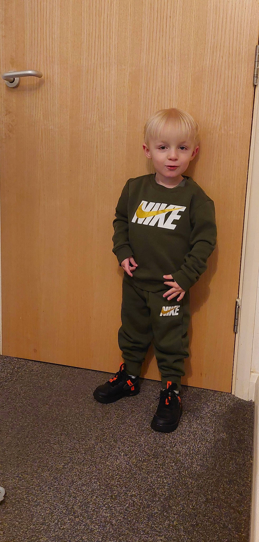 Charlie-ray is registered to the contest to win money with this photo: baby_toddler_clothing, child, face, floor, flooring, footwear, hardwood, knee, leg, neck, person, shoe, shoulder, sleeve, sneakers, sportswear, standing, sweatpant, t_shirt, toddler
