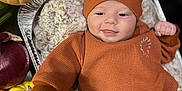 Gideon joined the competition — help win amazing prizes! baby, infant, orange_clothing, turkey_hat, blanket, autumn, pumpkin, vegetables, onion, sweet_potato, carrot, tray, smiling, face, indoors, cozy, festive, holiday, cute, child