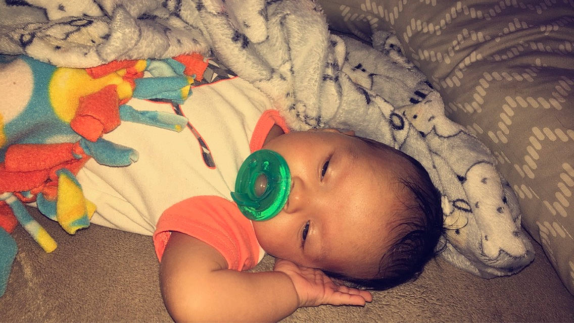 Azrael is registered to the contest to win money with this photo: baby, baby_toddler_clothing, bedtime, cheek, child, comfort, eye, face, flash_photography, fun, grass, happy, linens, mammal, mouth, nose, orange, person, portrait_photography, skin