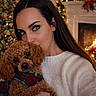 woman, dog, puppy, curly_hair, brown_fur, portrait, 抱抱, scarf, sweater, christmas, holiday, christmas_tree, fireplace, candles, garland, red_bow, warm_lighting, indoor, pet, cuddling
