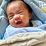 baby, blanket, blue, pacifier, face, expression, infant, clothing, cute, soft, wrapped, indoors, closeup, newborn, smile, lying_down, nap, baby_bib, child, portrait