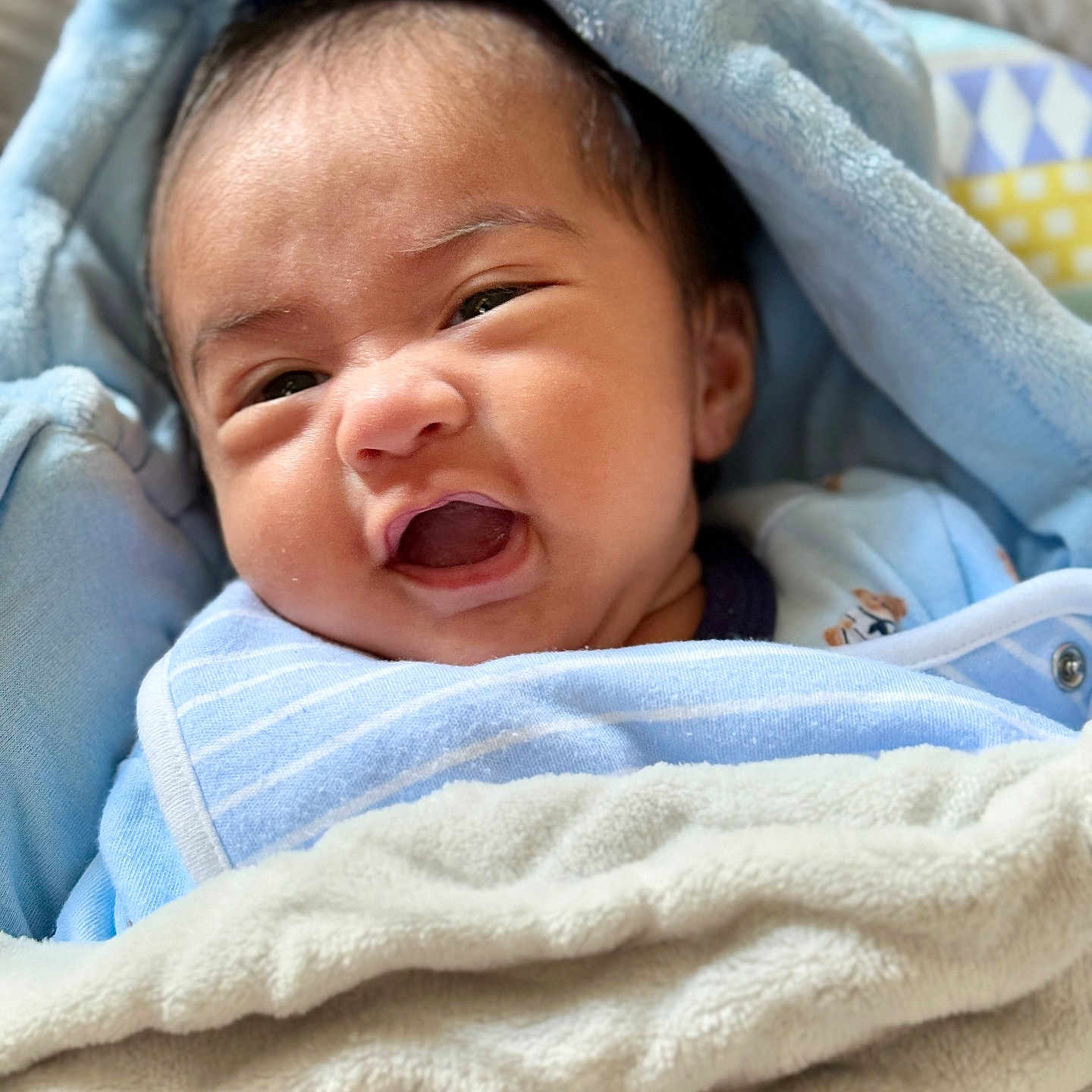 Josh Caleb is registered to the contest to win money with this photo: baby, baby_bib, blanket, blue, child, closeup, clothing, cute, expression, face, indoors, infant, lying_down, nap, newborn, pacifier, portrait, smile, soft, wrapped