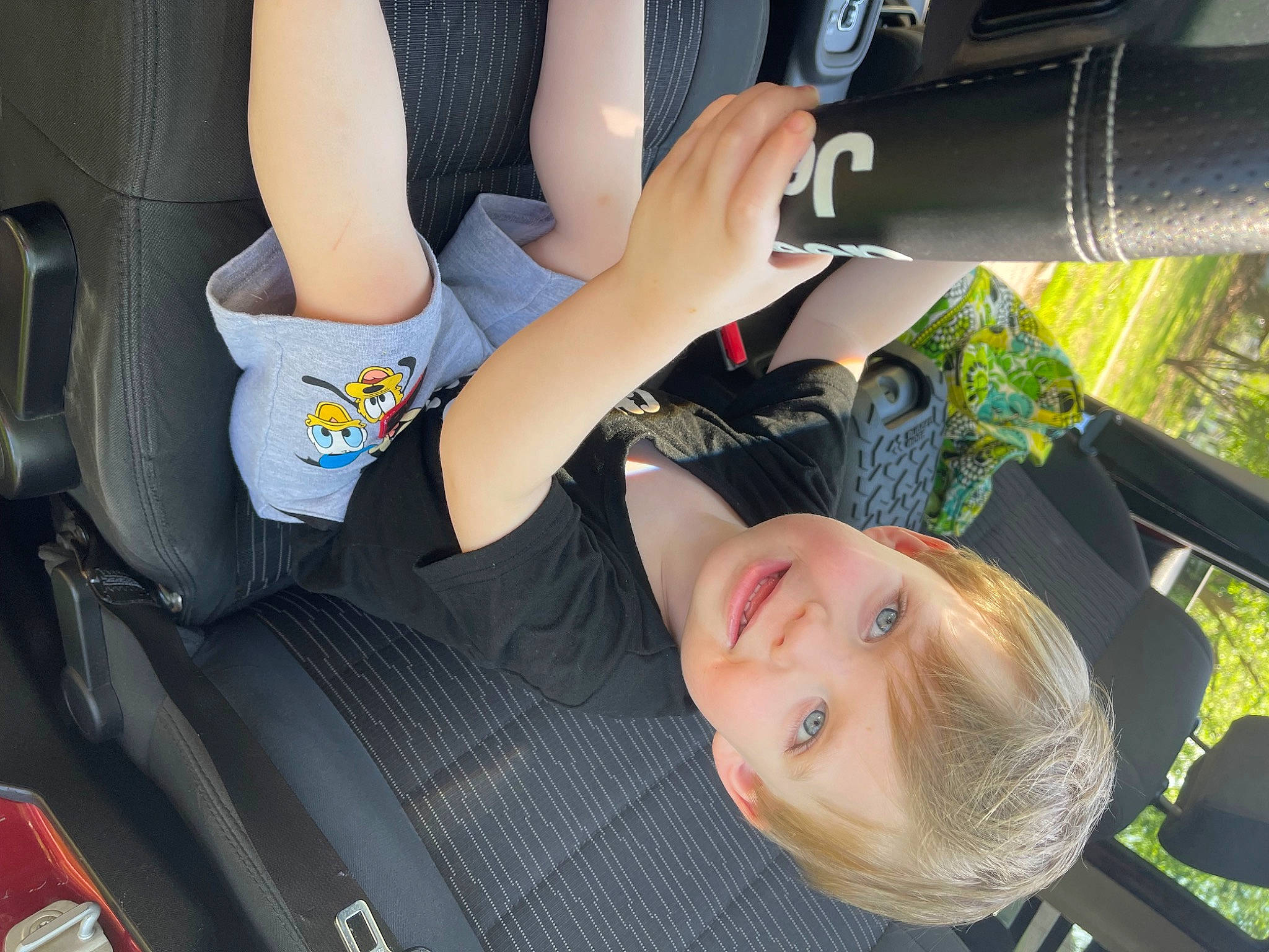 Levi joined the competition — help win amazing prizes! auto_part, automotive_design, automotive_exterior, car, car_seat, car_seat_cover, child, finger, fun, gesture, human_leg, joy, knee, leisure, motor_vehicle, person, smile, thigh, toddler, tree