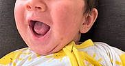 Theo joined the competition — help win amazing prizes! baby, blanket, cheerful, child, comfort, cozy, cute, expression, face, happy, head, indoors, infant, joy, person, portrait, seat, smiling, yellow_clothing, young
