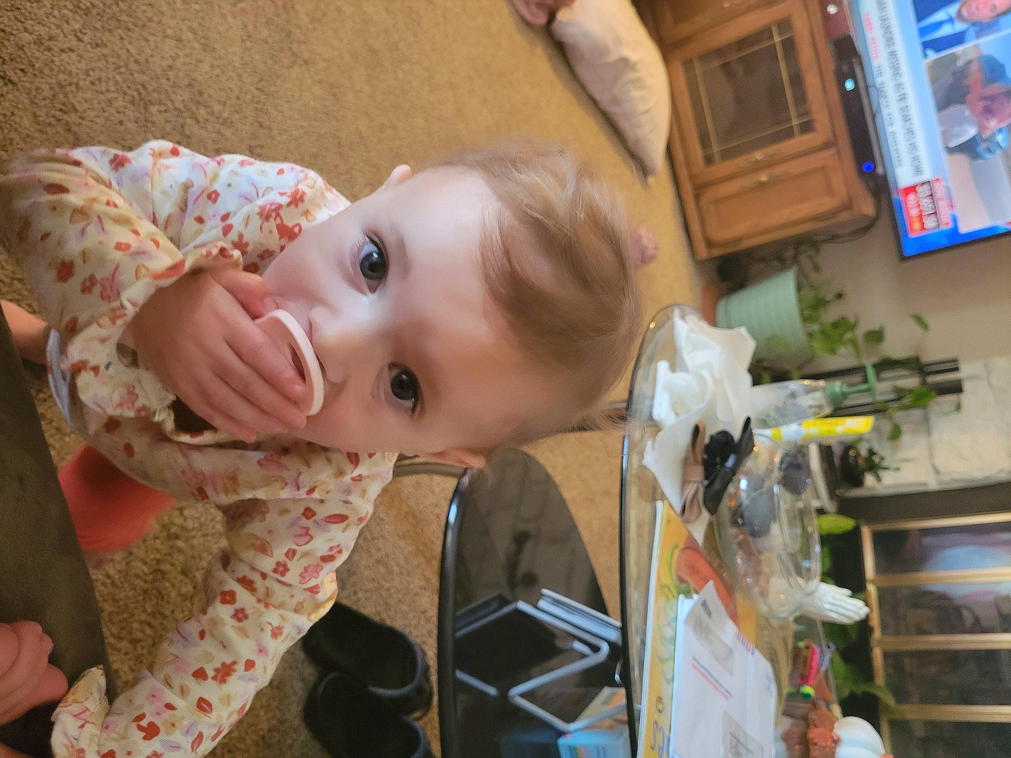 Everest is registered to the contest to win money with this photo: baby, baby_toddler_clothing, blurred, cheek, child, chin, eye, facial_expression, fun, happy, human_body, iris, mouth, nose, person, picture_frame, room, sitting, skin, smile