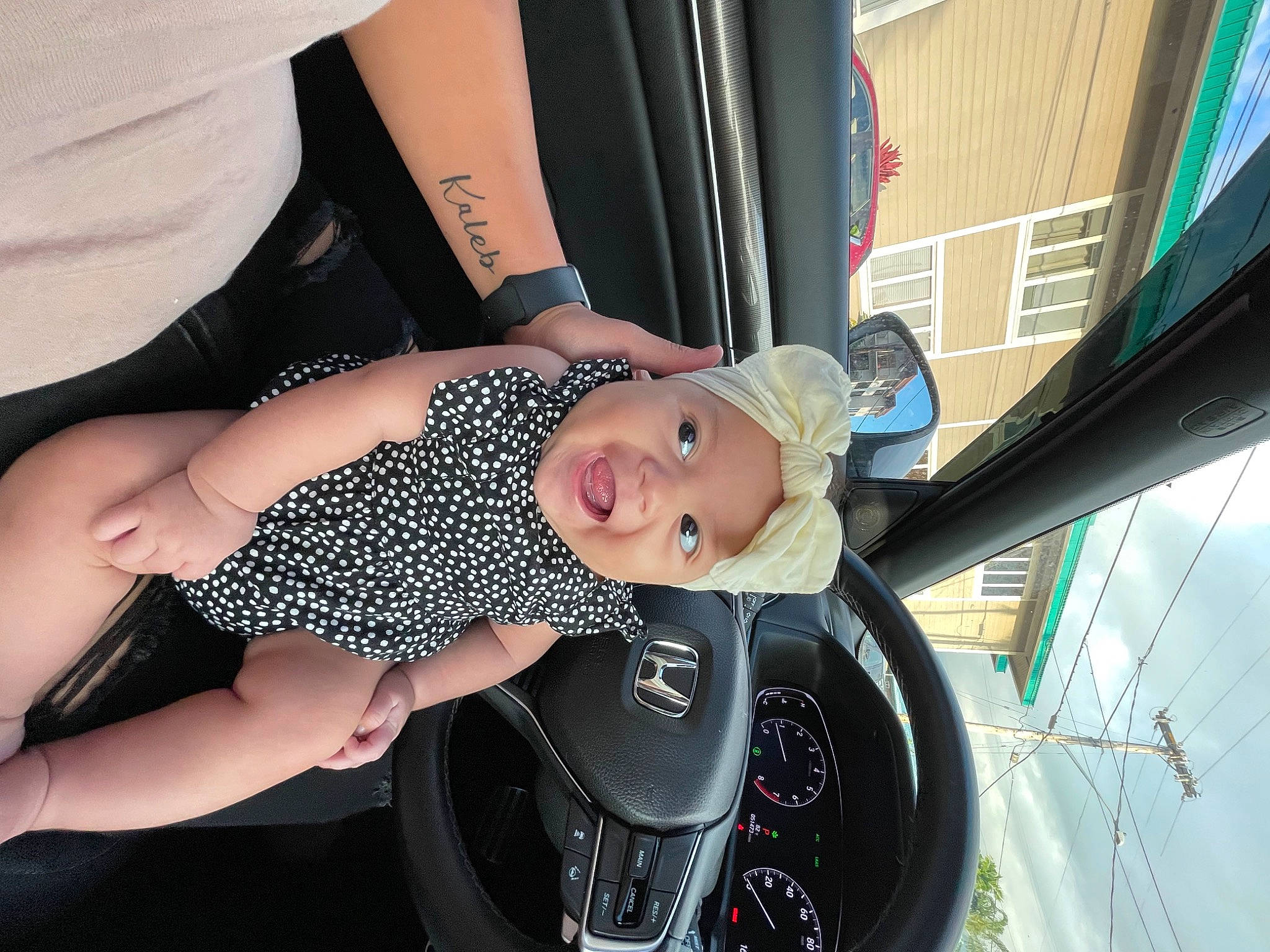 Kaia is registered to the contest to win money with this photo: auto_part, automotive_design, automotive_exterior, automotive_lighting, automotive_tire, automotive_wheel_system, black_hair, bumper, car, eyewear, flash_photography, hat, headwear, motor_vehicle, person, rim, sunglasses, thigh, tire, toddler