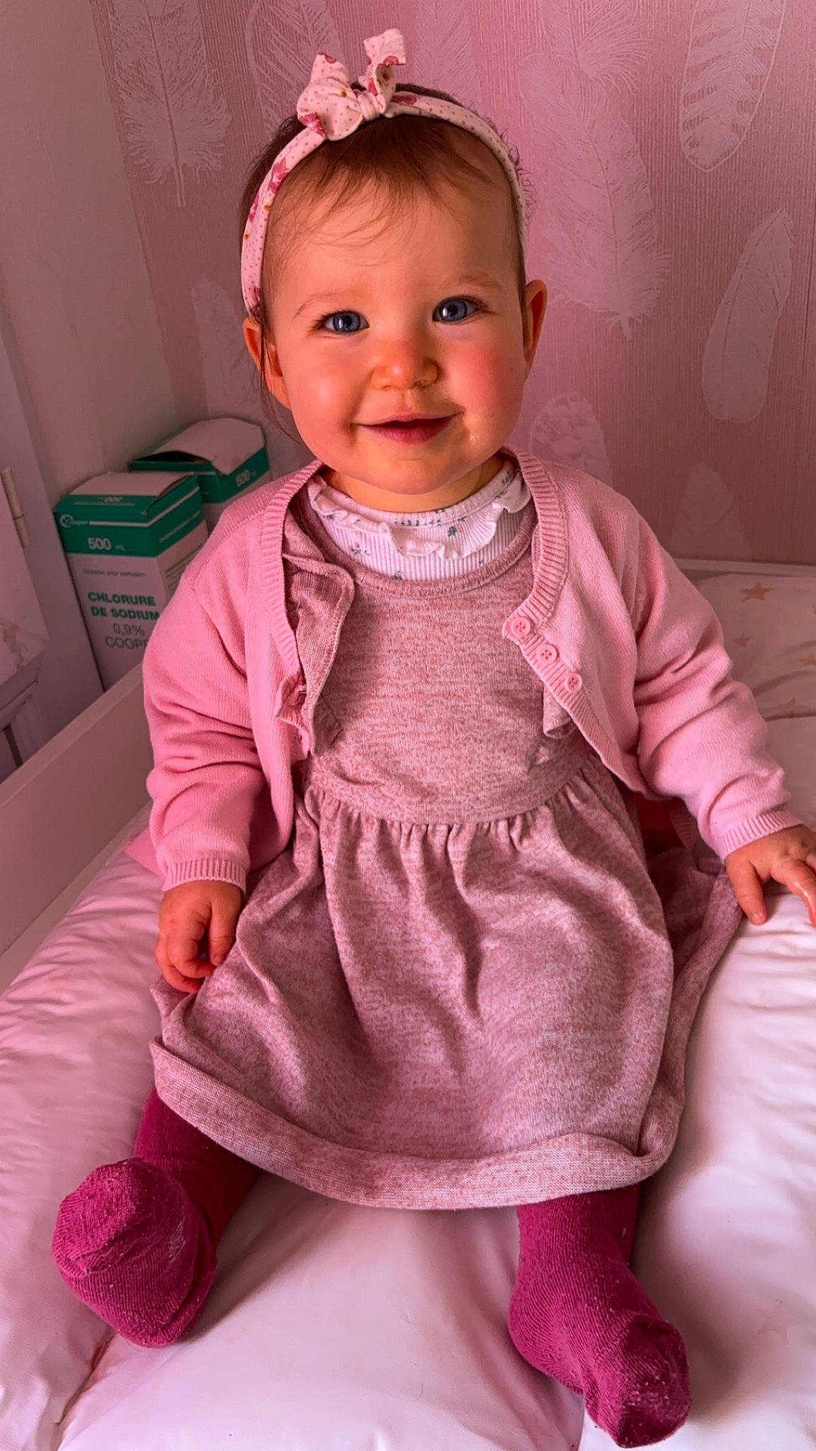 énora participe au concours pour gagner de l'argent avec cette photo : baby, baby_toddler_clothing, cheek, child, dress, eyelash, facial_expression, finger, happy, joy, lip, magenta, nose, organ, outerwear, person, pink, purple, skin, sleeve