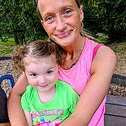 Jimma joined the competition — help win amazing prizes! child, woman, smile, outdoor, park, greenery, curly_hair, tank_top, bright_clothing, hug, happy, playground, daylight, person, nature, bench, casual, family, portrait, toddler