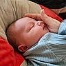 Cyrus is registered to the contest to win money with this photo: newborn, baby, sleeping, hand, blanket, cushion, soft, face, peaceful, resting, infant, portrait, cozy, closeup, skin, comfort, indoor, person, tender, love