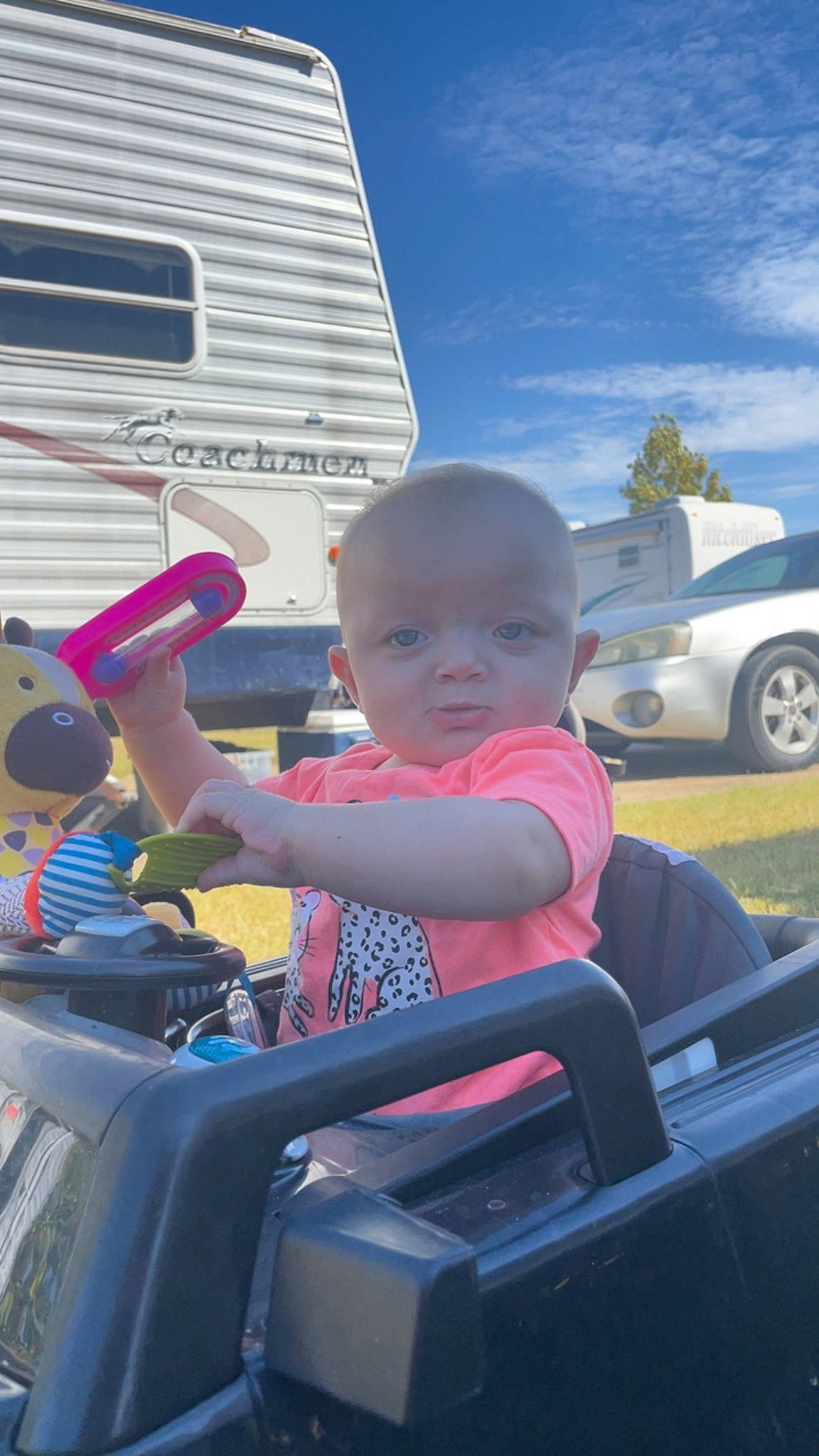 Josephine is registered to the contest to win money with this photo: auto_part, automotive_design, automotive_exterior, automotive_lighting, automotive_tire, bumper, car, cloud, hood, leisure, mode_of_transport, motor_vehicle, person, sky, steering_wheel, tire, toddler, vehicle, vehicle_door, wheel