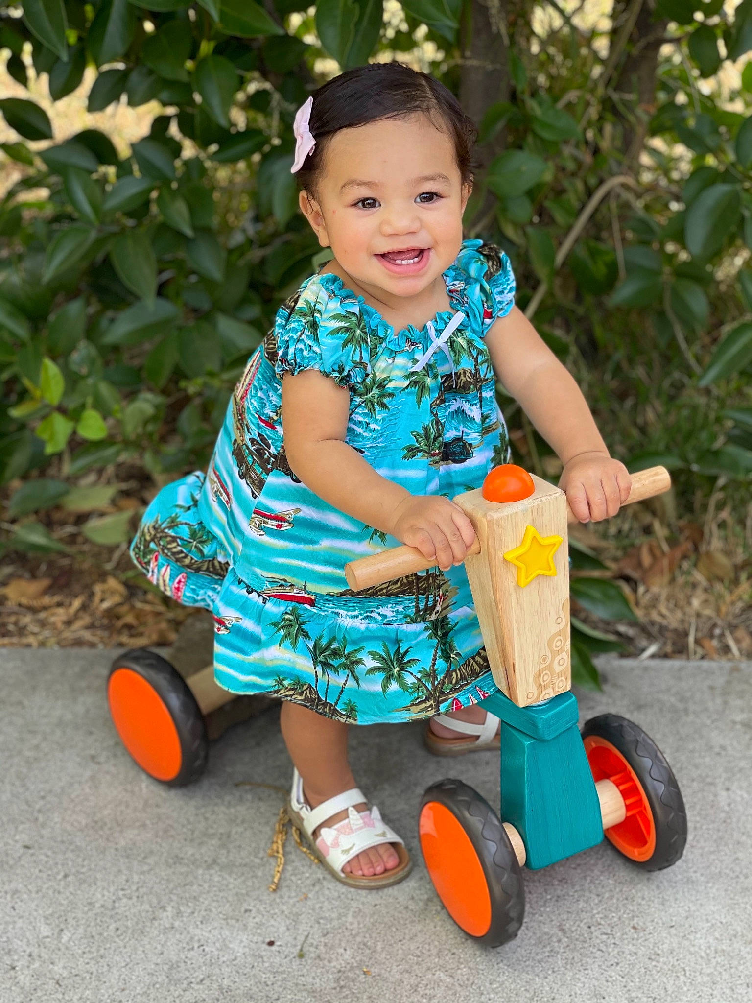 Monroe joined the competition — help win amazing prizes! automotive_wheel_system, baby_toddler_clothing, child, electric_blue, fun, grass, happy, joy, leisure, magenta, people_in_nature, person, plant, plastic, play, recreation, riding_toy, smile, tire, toddler