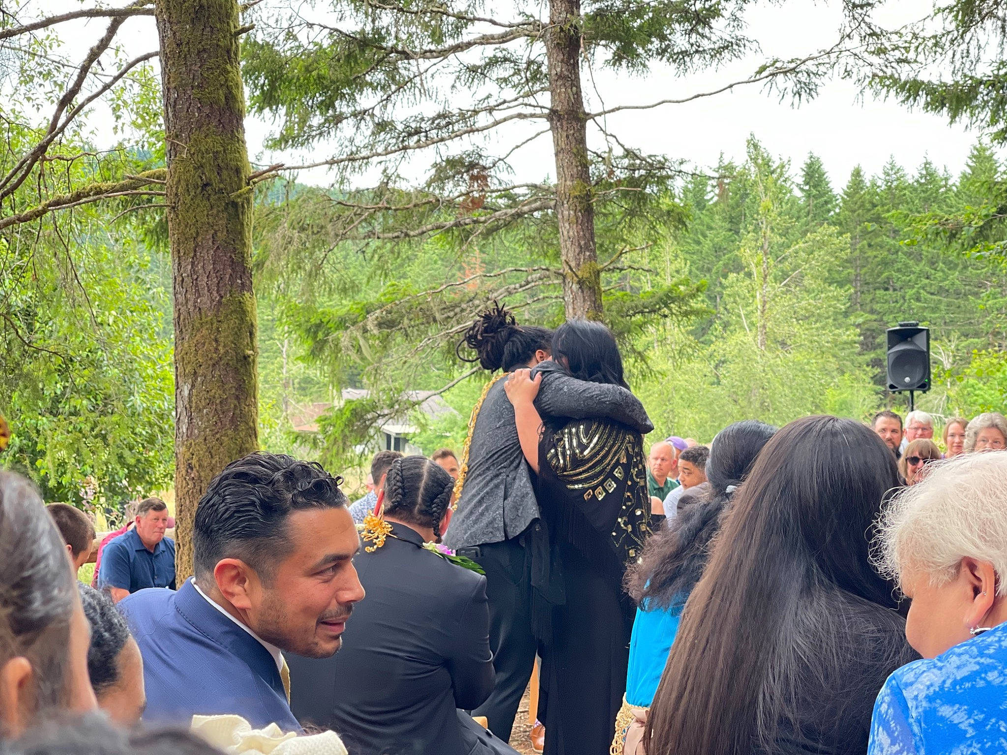 Monroe is registered to the contest to win money with this photo: baseball_cap, conversation, crowd, event, forest, fun, hat, human, leisure, outerwear, person, public_event, recreation, shirt, sky, soil, sun_hat, t_shirt, tourism, tree