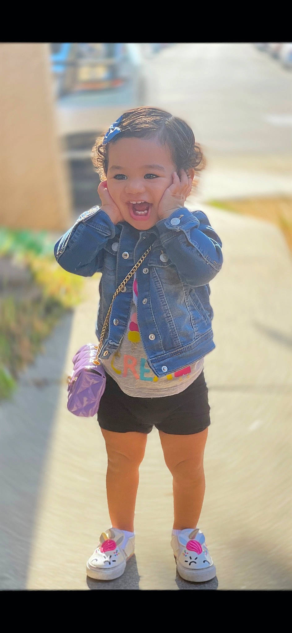 Monroe is registered to the contest to win money with this photo: child, denim, electric_blue, face, facial_expression, fun, happy, human_leg, leg, leisure, pattern, person, recreation, shorts, sleeve, smile, standing, street_fashion, t_shirt, thigh