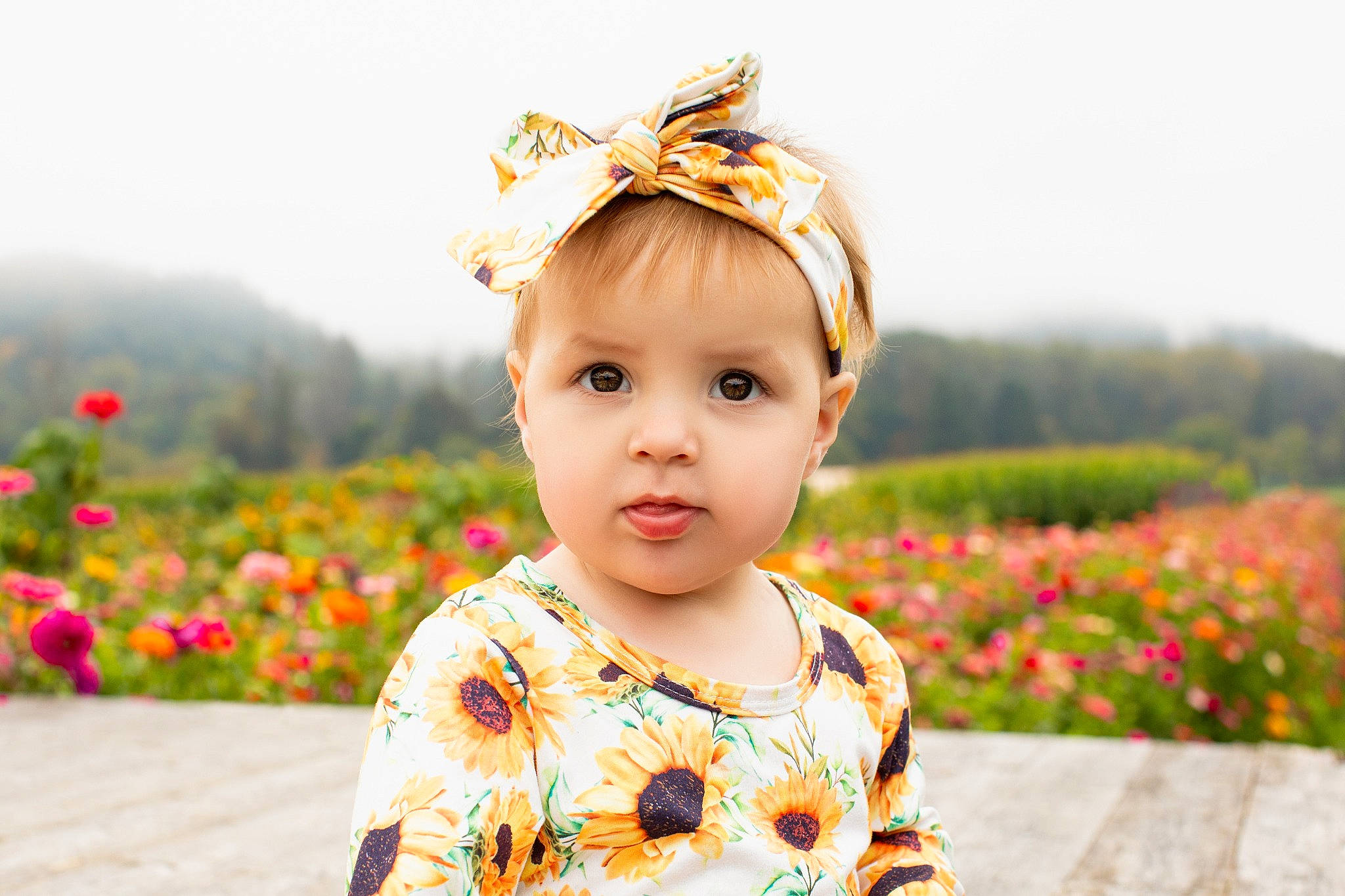 Raylee joined the competition — help win amazing prizes! baby, baby_toddler_clothing, child, facial_expression, flower, grass, hairstyle, happy, head, headwear, human, iris, morning, people_in_nature, person, photograph, plant, skin, sky, standing