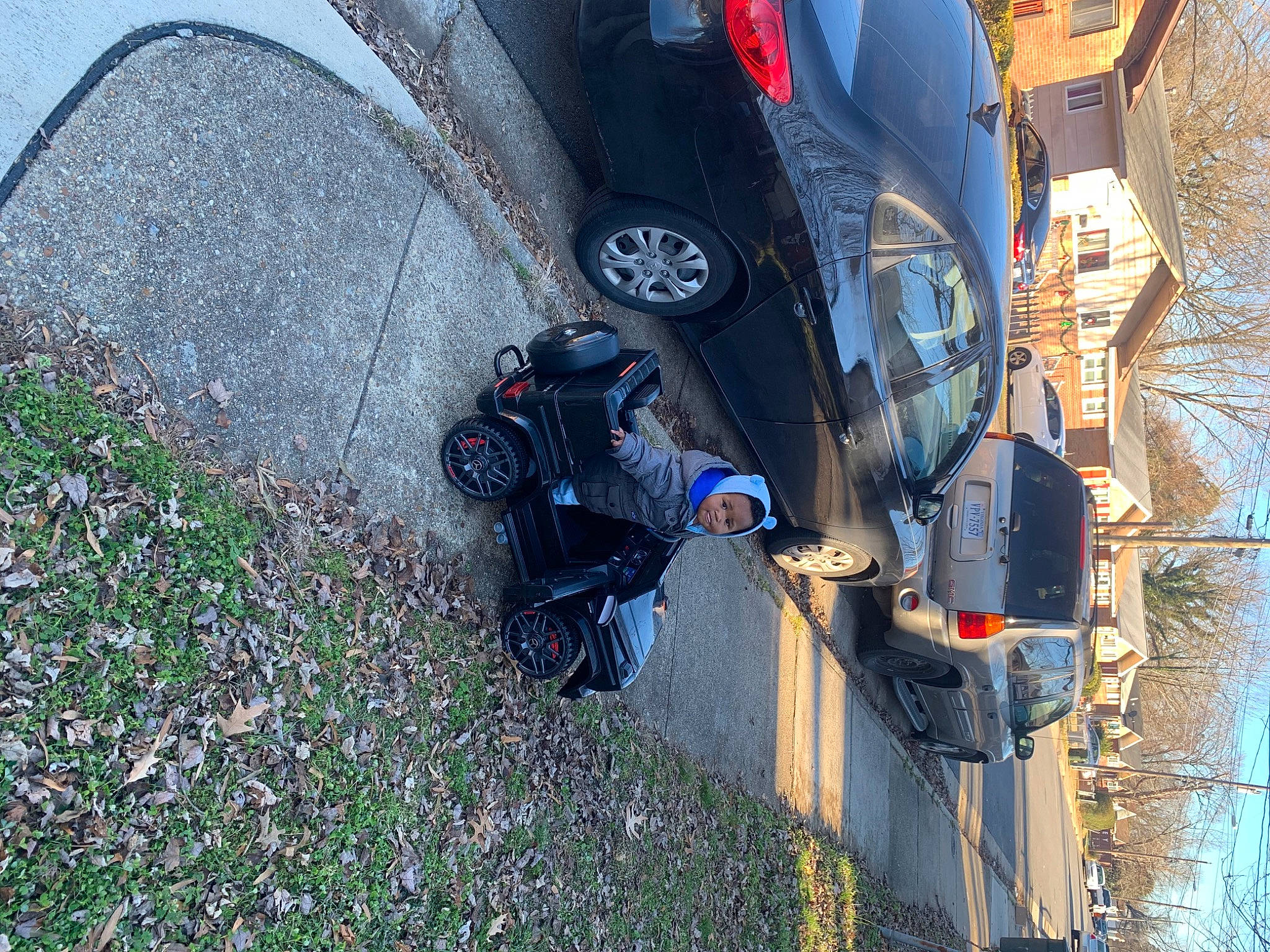 Karsyn joined the competition — help win amazing prizes! asphalt, automotive_exterior, automotive_lighting, automotive_tire, automotive_wheel_system, bumper, car, fender, hood, motor_vehicle, person, plant, rim, sky, tire, tread, tree, vehicle, vehicle_door, wheel