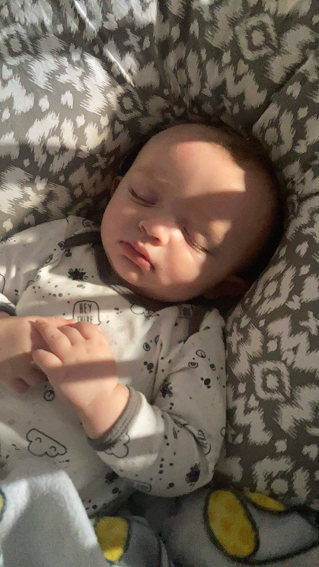 Cullen is registered to the contest to win money with this photo: baby, baby_sleeping, baby_toddler_clothing, bed, bedding, bedtime, cheek, child, comfort, eyebrow, finger, hand, linens, mouth, nose, pattern, person, skin, sleeve, textile
