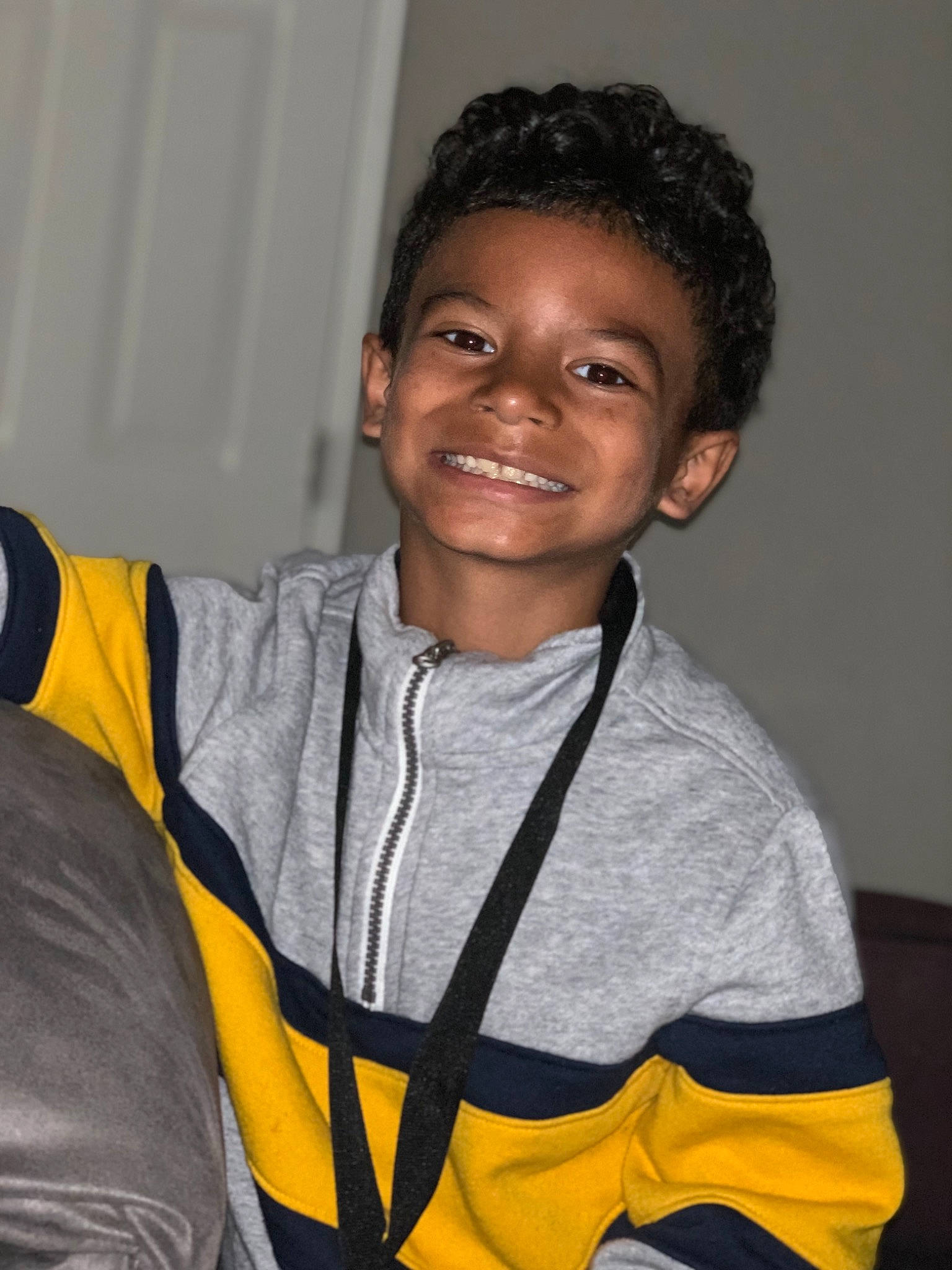 Josiah is registered to the contest to win money with this photo: joy, outerwear, person, smile