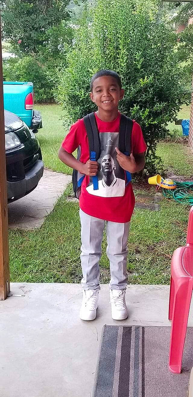 Cameron is registered to the contest to win money with this photo: child, joy, person, plant, shoe