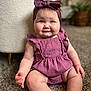 adorable, baby, candid, carpet, child, chubby_cheeks, closeup, cute, furniture, happy, headband, home, indoor, infant, person, portrait, purple_outfit, sitting, smiling, soft_lighting