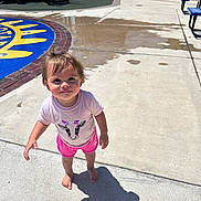 Leilani joined the competition — help win amazing prizes! barefoot, bench, child, concrete, cow_graphic, curious_expression, daylight, fence, outdoor, pink_shorts, play_area, playground, rosy_cheeks, shadow, short_hair, slide, summer_clothing, sunny, toddler, white_tshirt