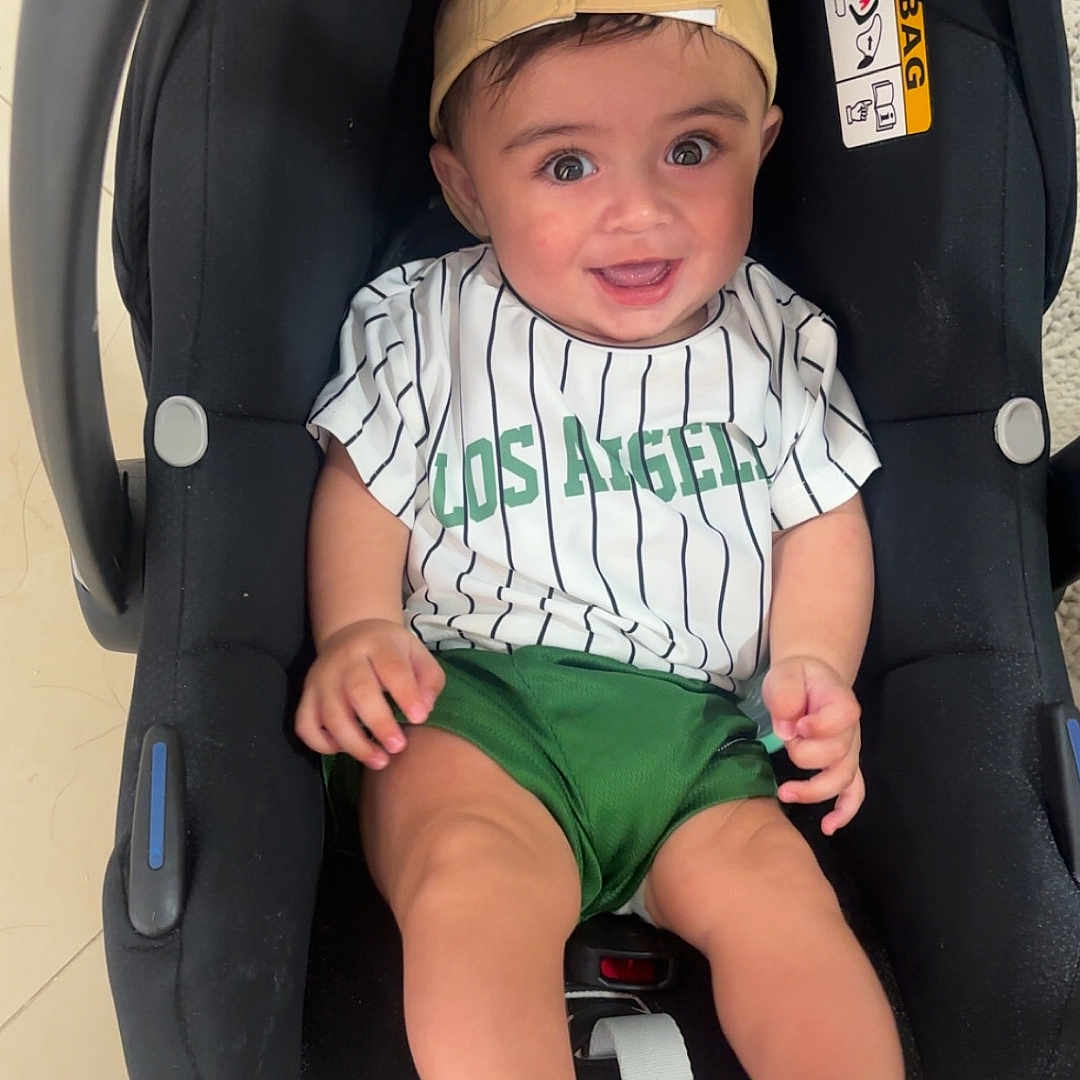 Lucien joined the competition — help win amazing prizes! baby, baseballcap, bodypart, cap, car, clothing, cushion, face, finger, hand, hat, head, person, photography, portrait, shorts, stroller, t_shirt, transportation, vehicle