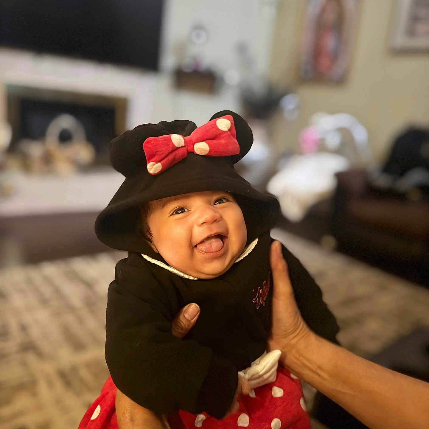 Lucy joined the competition — help win amazing prizes! baby, black_clothing, carpet, child, costume, cute, hands, happy, hat, indoor, infant, living_room, person, playful, polka_dot, portrait, red_bow, smiling, sofa, tongue_out