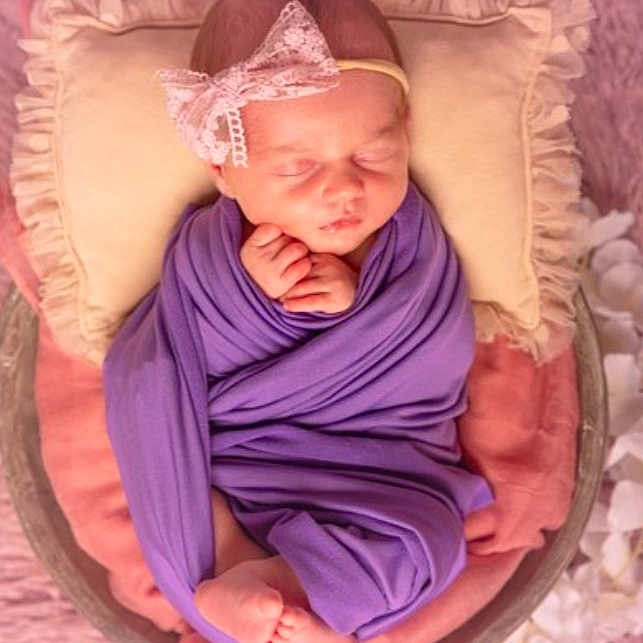 Inaya participe au concours pour gagner de l'argent avec cette photo : baby, basket, bed, blanket, clothing, cradle, crib, cushion, face, furniture, hat, head, homedecor, infantbed, newborn, person, photography, portrait, purple, sleeping