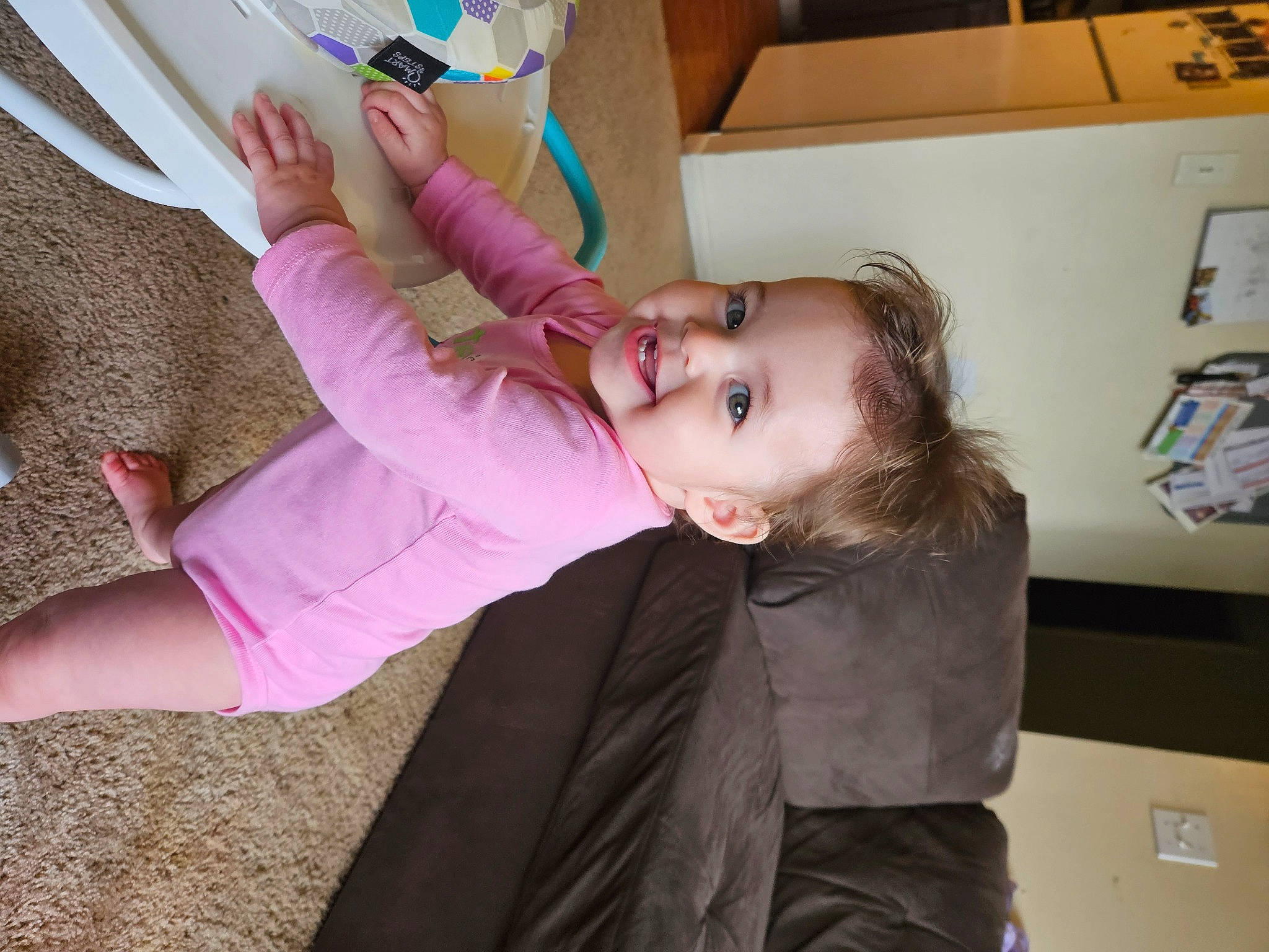 Tracy is registered to the contest to win money with this photo: baby, child, eyelash, fun, gesture, happy, human_leg, joy, knee, magenta, nail, neck, person, room, skin, smile, tableware, thigh, toddler, water_bottle