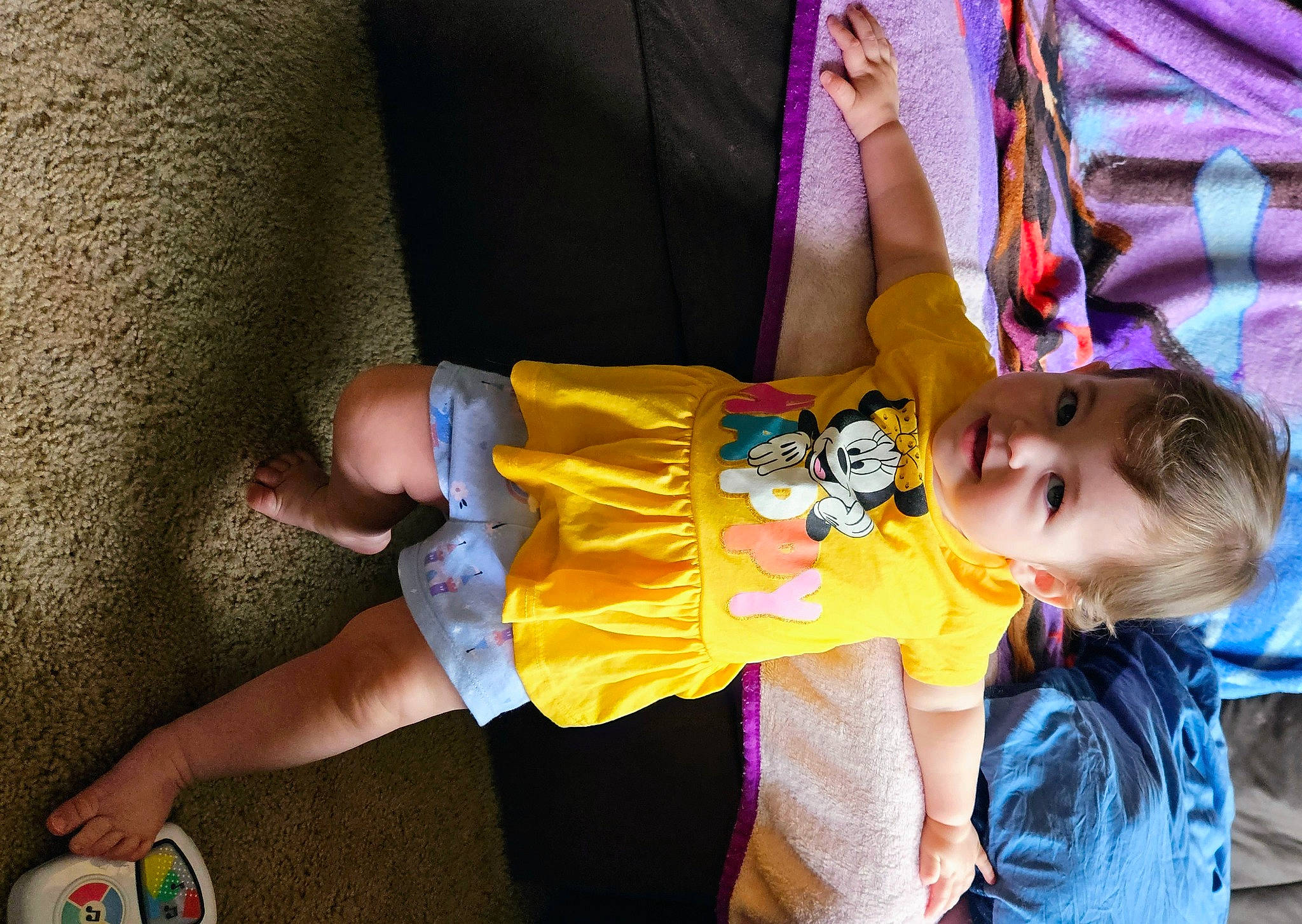 Tracy is registered to the contest to win money with this photo: baby, baby_products, child, costume, event, fun, happy, human_leg, leisure, person, play, recreation, shorts, sitting, smile, t_shirt, thigh, toddler, tree, vacation