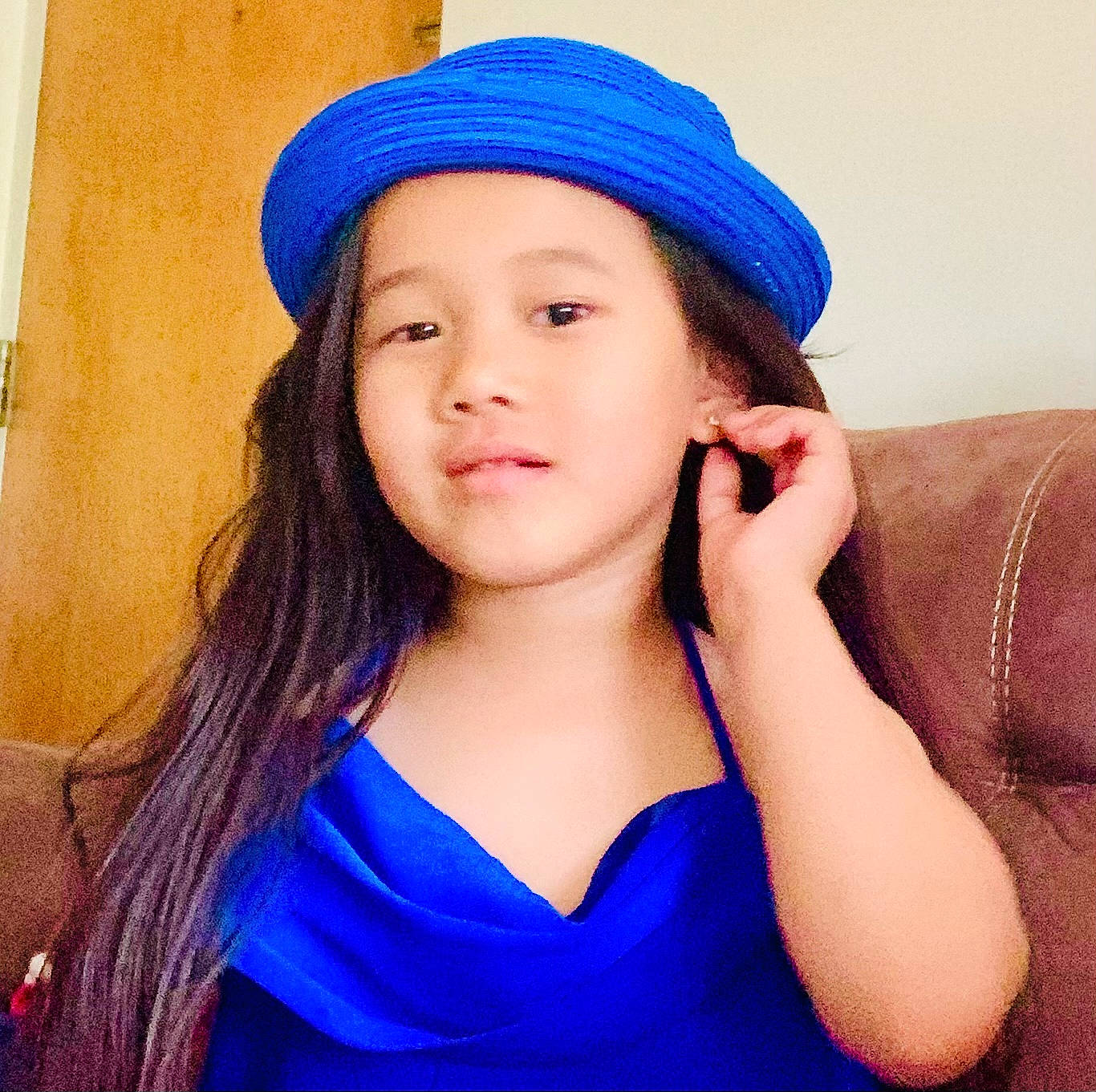 Eva is registered to the contest to win money with this photo: azure, beauty, blue, cap, clothing, costume_hat, electric_blue, eyelash, flash_photography, gesture, happy, hat, headpiece, headwear, lip, long_hair, neck, person, purple, sleeve