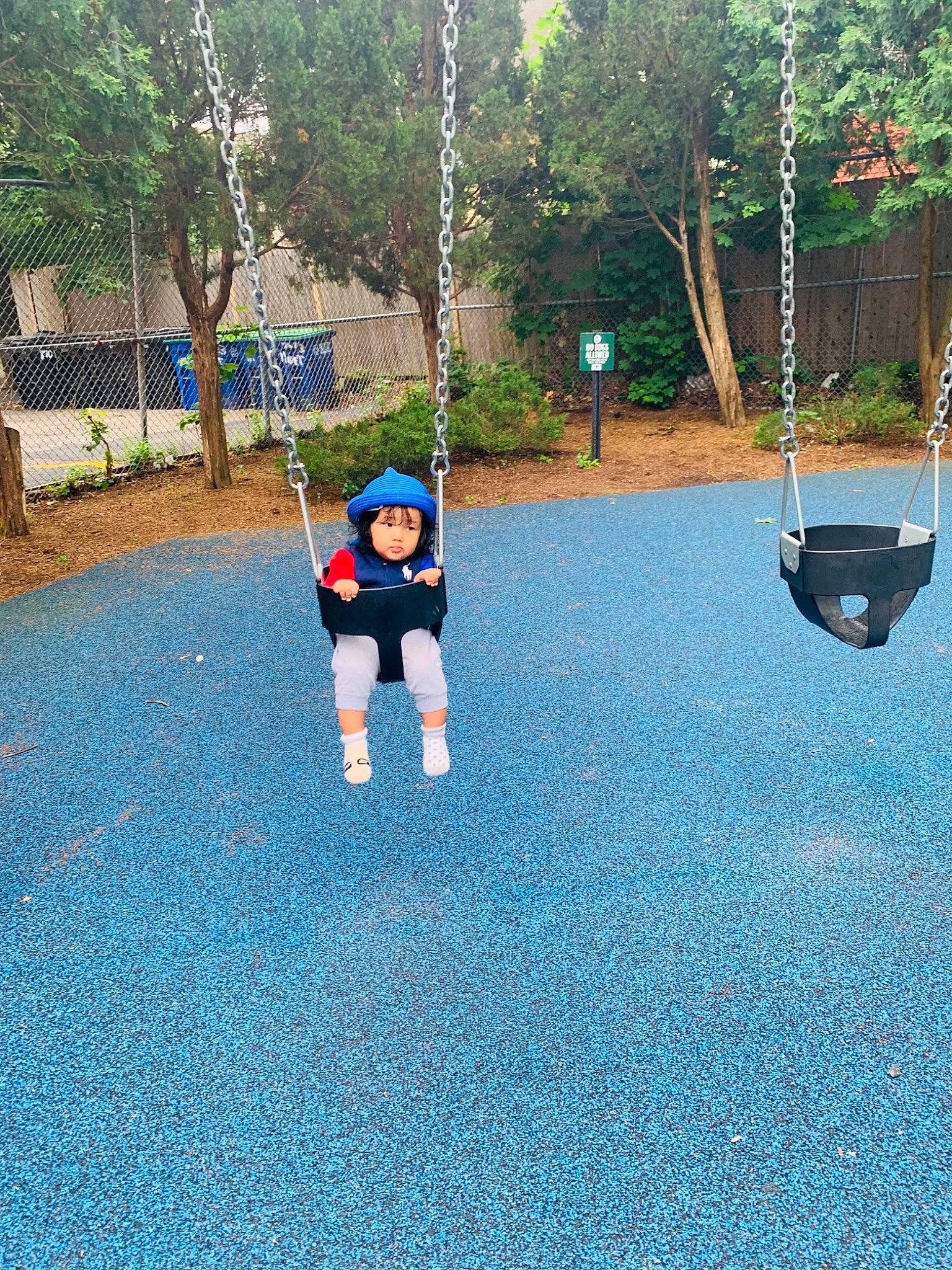Eva joined the competition — help win amazing prizes! asphalt, city, electric_blue, flooring, fun, grass, headwear, landscape, leisure, outdoor_play_equipment, people_in_nature, person, plant, play, playground, recreation, road_surface, shadow, soil, swing