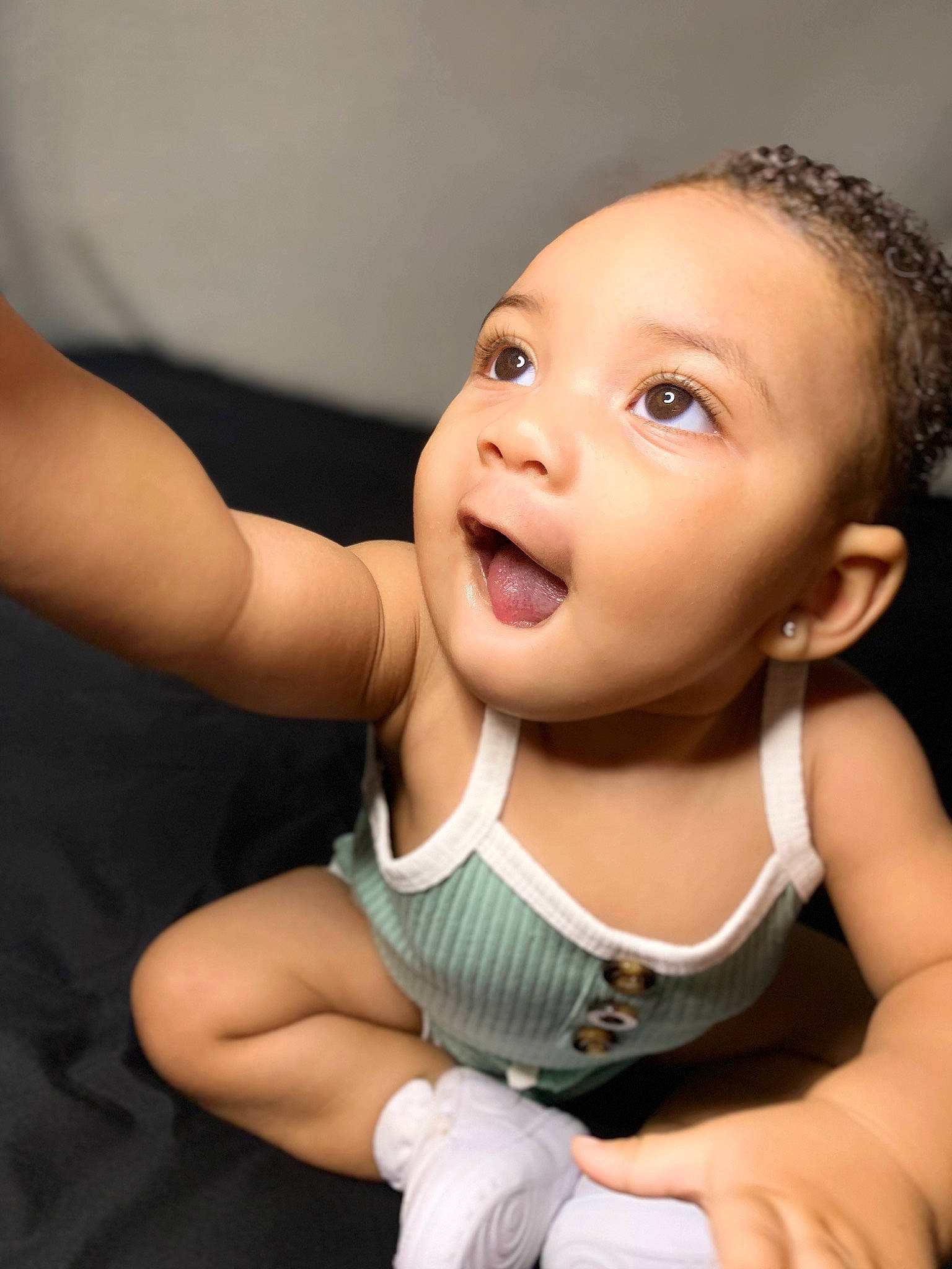 Jaliyah is registered to the contest to win money with this photo: arm, baby_toddler_clothing, cheek, comfort, ear, eyebrow, eyelash, finger, flash_photography, gesture, happy, iris, joint, lip, mouth, neck, nose, person, skin, sleeve