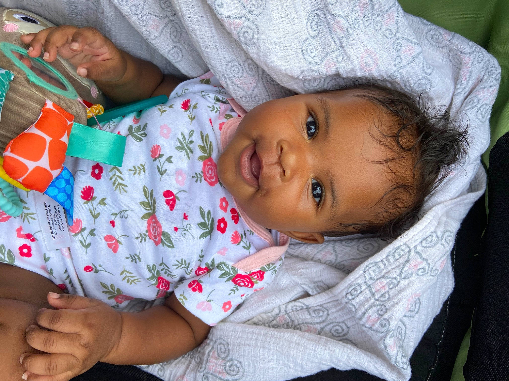 Goddess is registered to the contest to win money with this photo: adaptation, baby, baby_toddler_clothing, cheek, child, comfort, face, facial_expression, hand, happy, human_body, linens, lip, mouth, nose, person, sitting, skin, smile, toddler