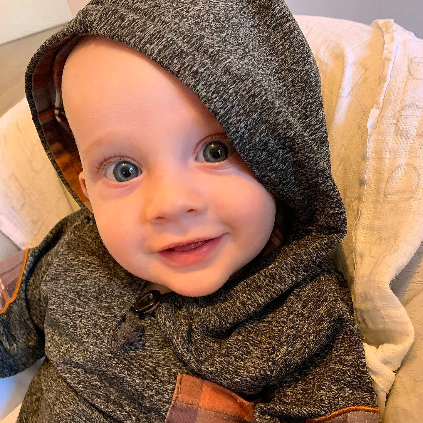 Miles is registered to the contest to win money with this photo: baby, cap, cheek, chin, cool, eye, eyebrow, face, happy, hat, headgear, iris, lip, nose, outerwear, person, skin, sleeve, smile, textile